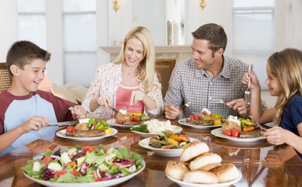 Family-Enjoying-Dinner-food